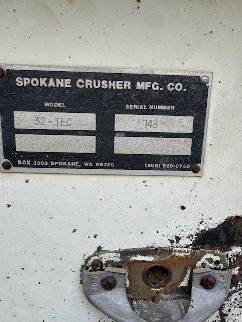 A spokane crusher mfg. co. label on a white surface