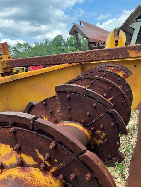 A bunch of rusty metal pieces are sitting on the ground