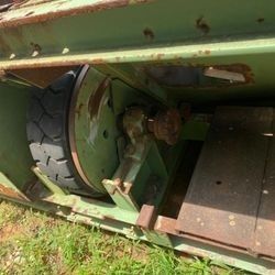 A close up of a machine with a tire on it.