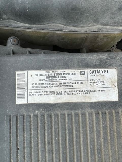 A close up of a catalyst label on a car