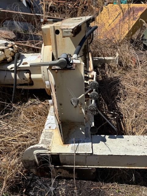 A machine is sitting in the middle of a field