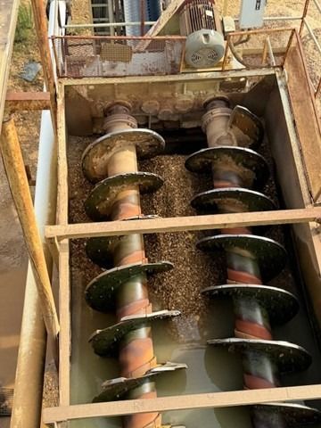 A close up of a machine with a lot of screws in it.