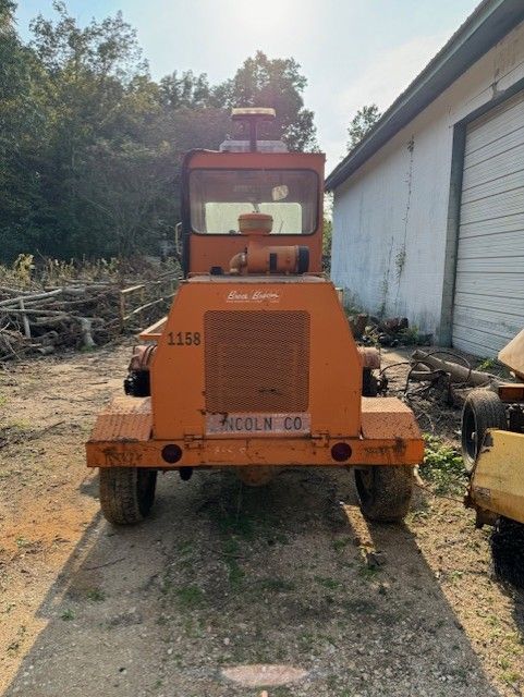An orange truck with a license plate that says 1138