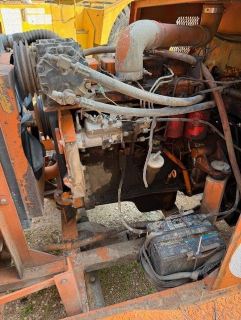 A close up of the engine of a tractor.