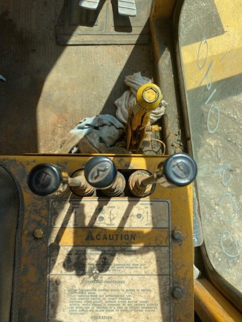 A close up of a machine with a caution sign on it