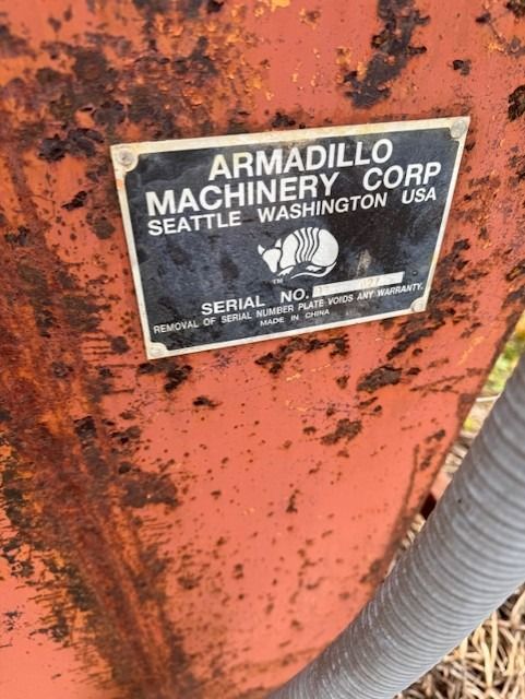 Armadillo machinery corp seattle washington usa is written on a rusty metal surface