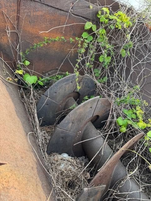 A bunch of pieces of metal are laying on the ground