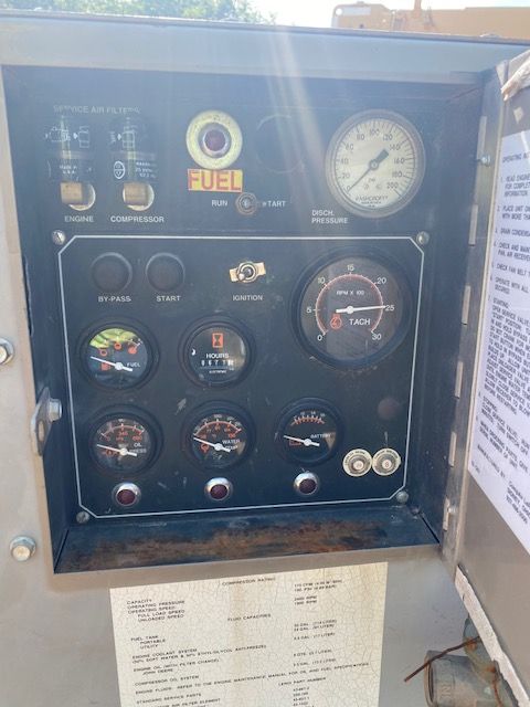 A fuse box with a bunch of gauges and buttons