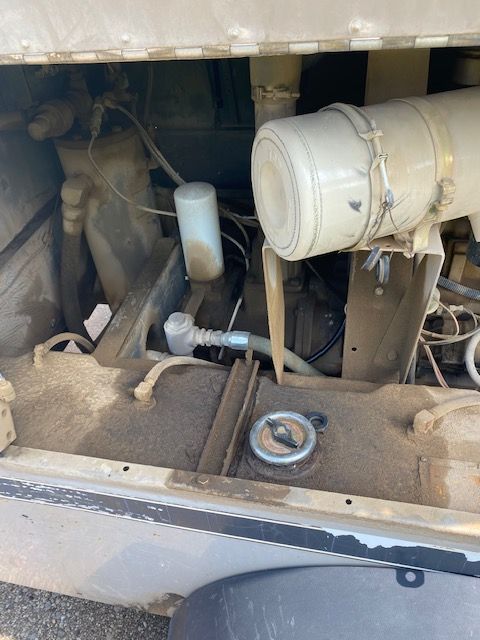 A close up of a car engine with a filter on it.