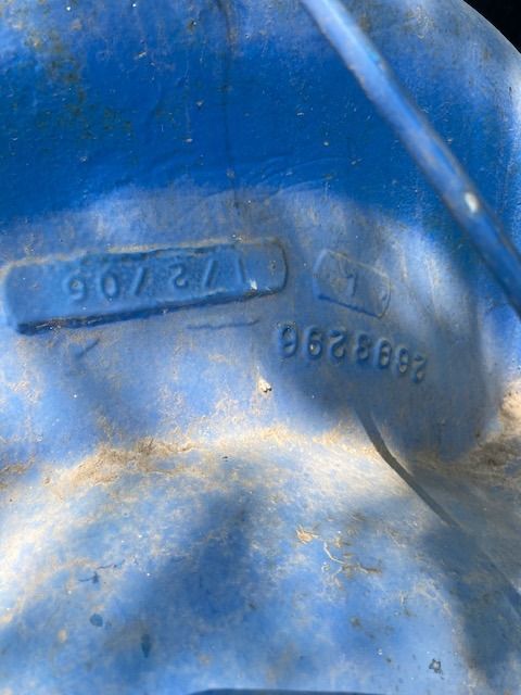 A close up of a blue object with a number on it.