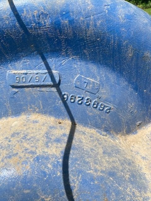 A close up of a blue plastic container with numbers on it