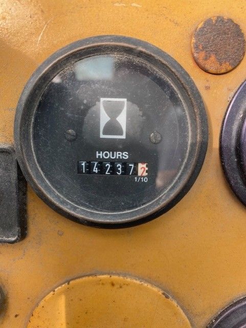 A close up of a clock that says hours on it