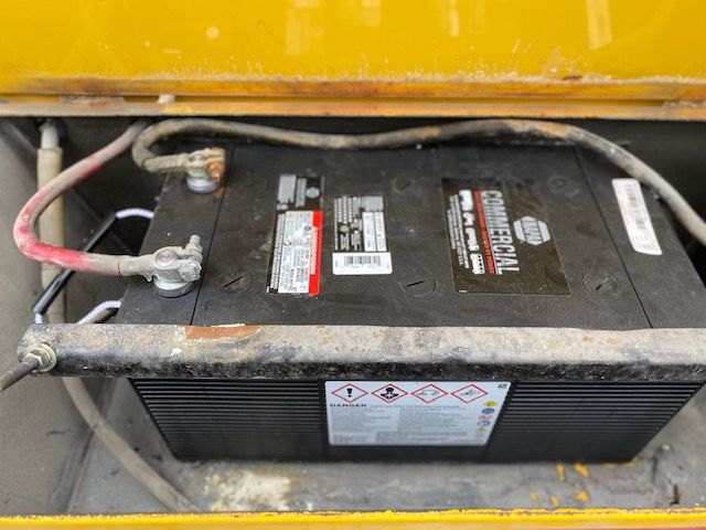 A black battery with the word commercial on it