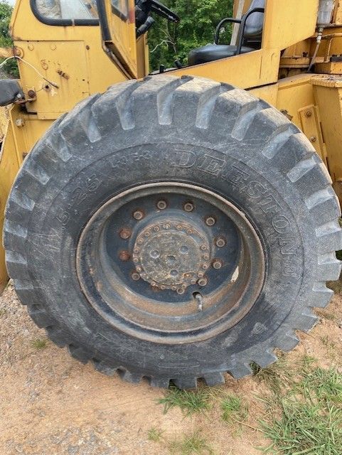 A close up of a large tire on a tractor