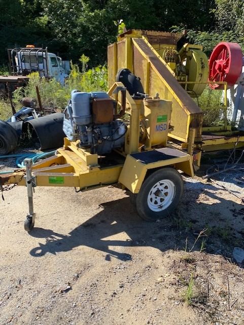 A yellow trailer with a diesel engine on it