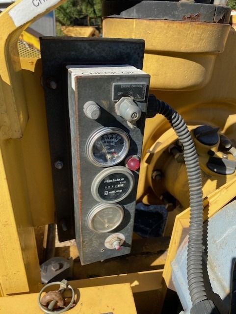 A close up of a control panel on a yellow vehicle
