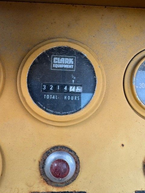 A close up of a clark equipment dashboard