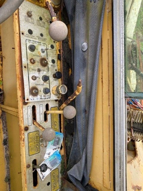A close up of a machine with a lot of buttons on it.