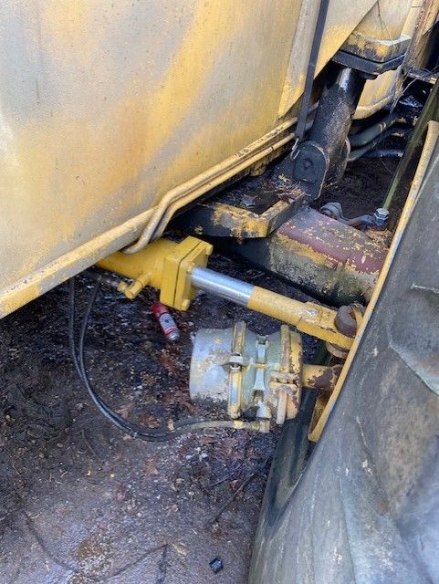 A close up of a hydraulic system on a tractor.