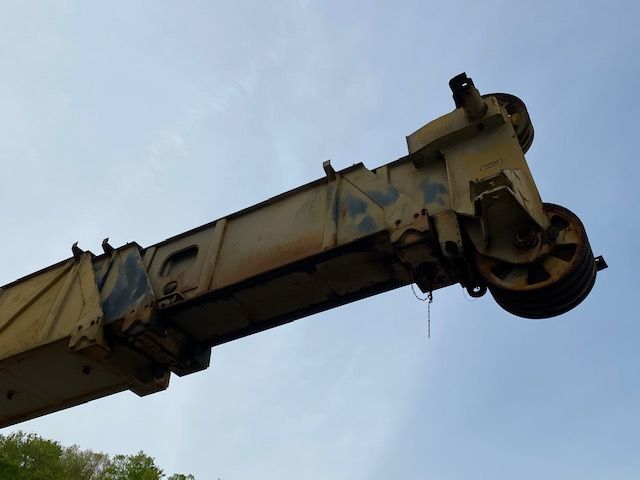 A large crane with a blue sky in the background