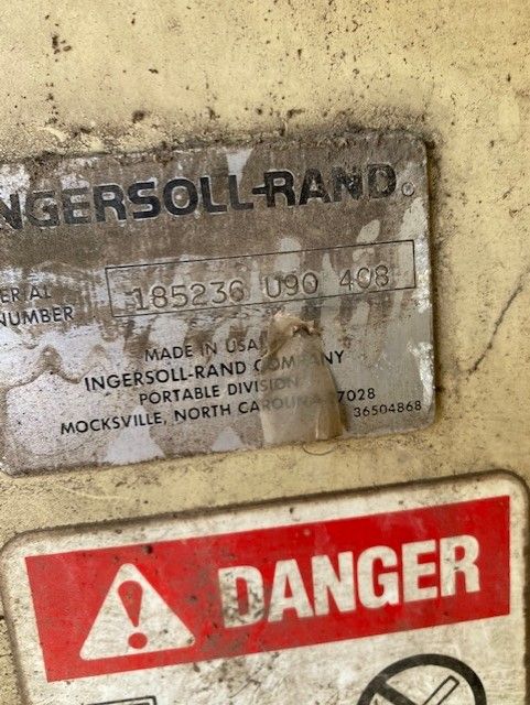 A red and white sign that says danger on it