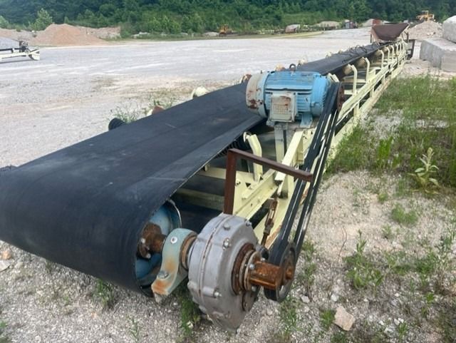 A conveyor belt with a motor attached to it