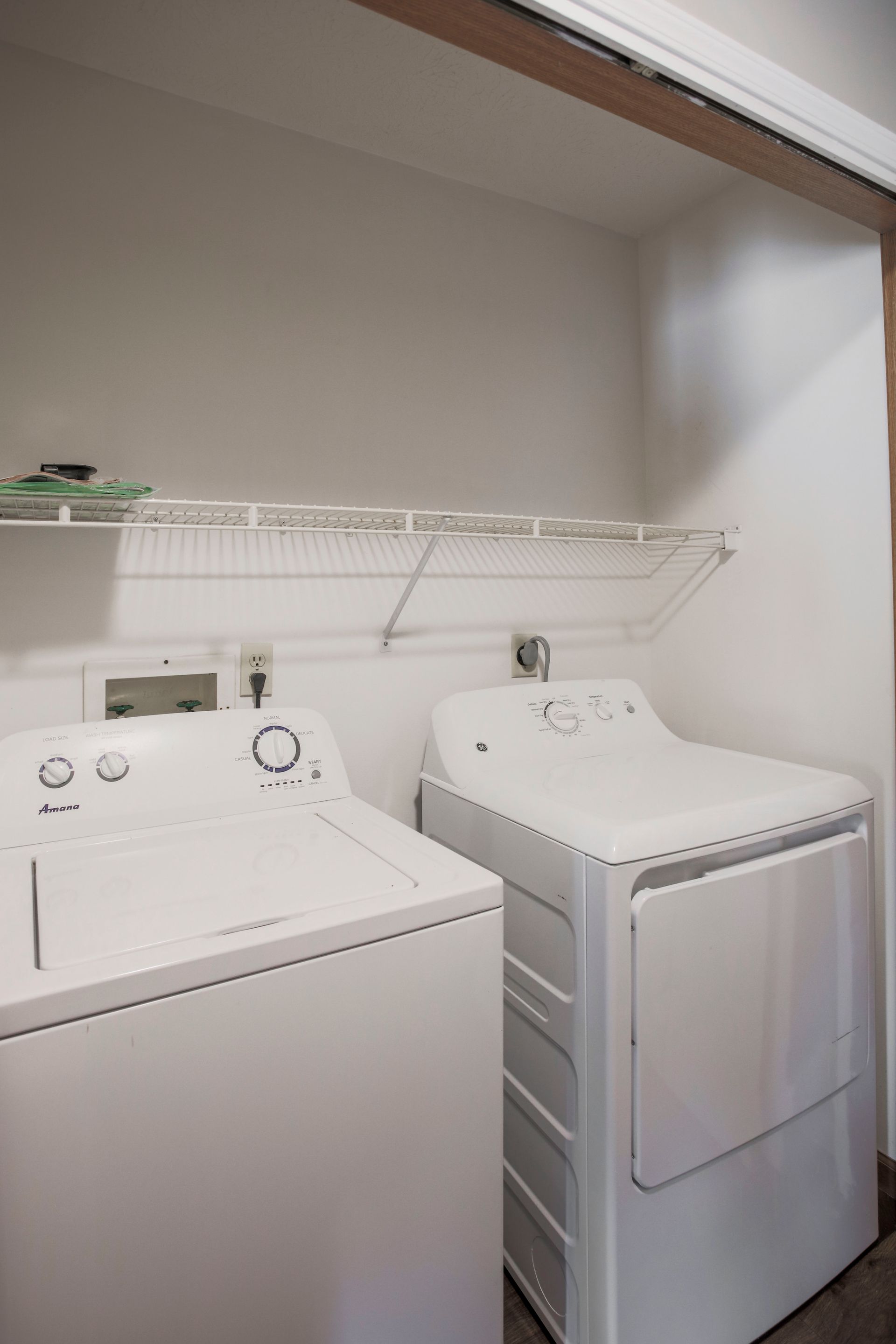 a laundry room with a washer and dryer in it .