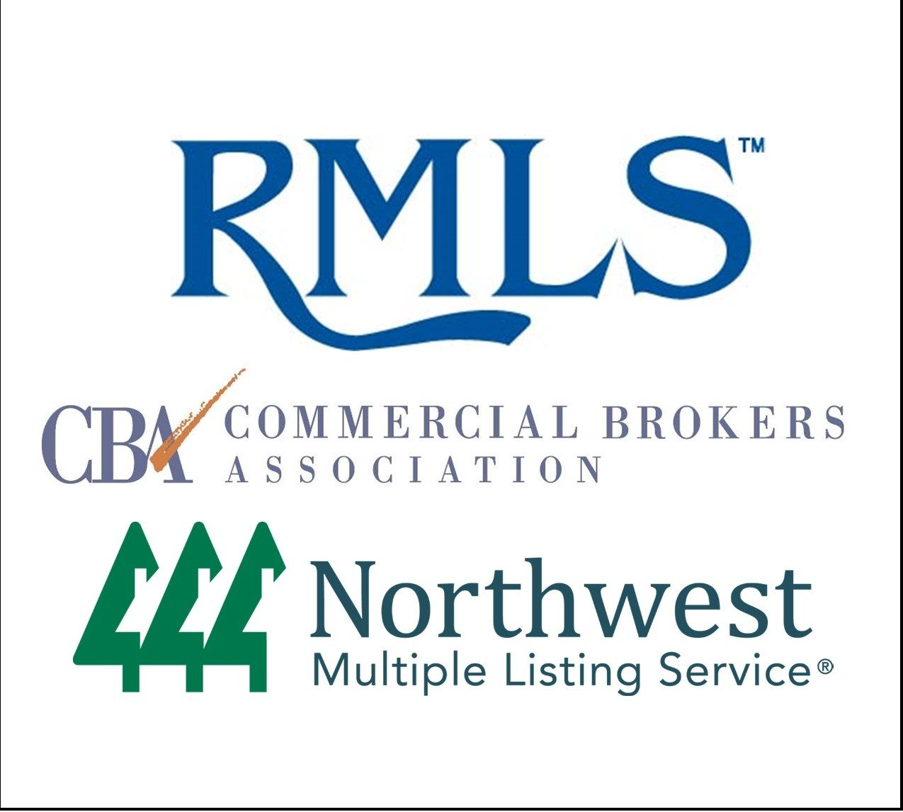 A woman is sitting at a desk with a laptop and a vase of flowers.