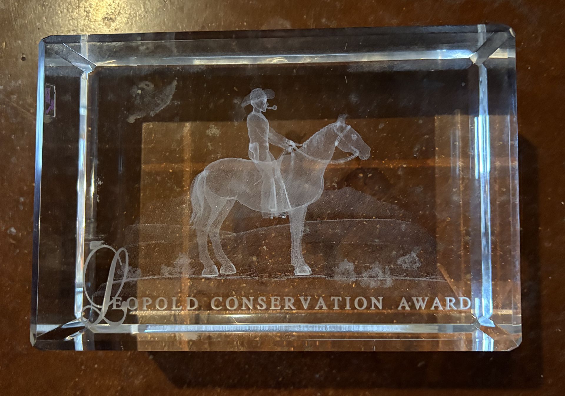 Glass award, etched with a rider on horseback, text 