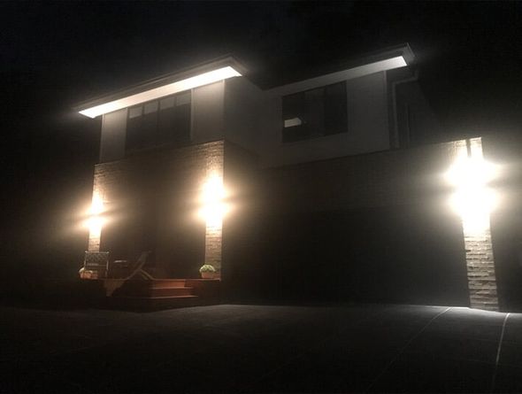 Two-Storey House With Outdoor Lights — Ceassa Electrical in Salamander Bay, NSW