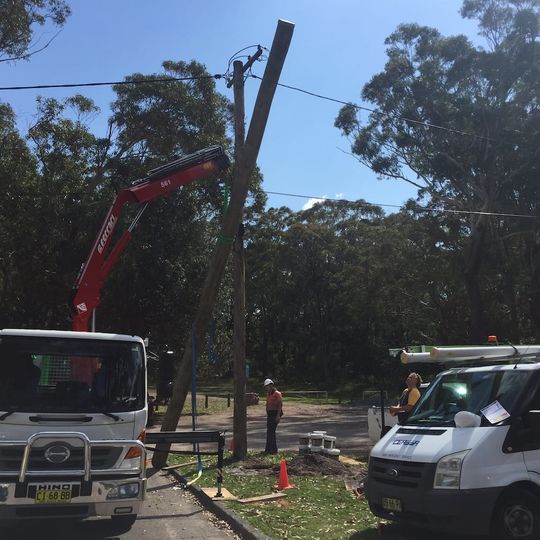 Electricians Installing Electrical Post — Electrical & Fire Safety Services in Salamander Bay, NSW