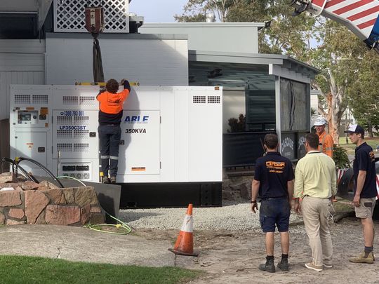 Electrician Repairing Generator — Electrical & Fire Safety Services in Salamander Bay, NSW