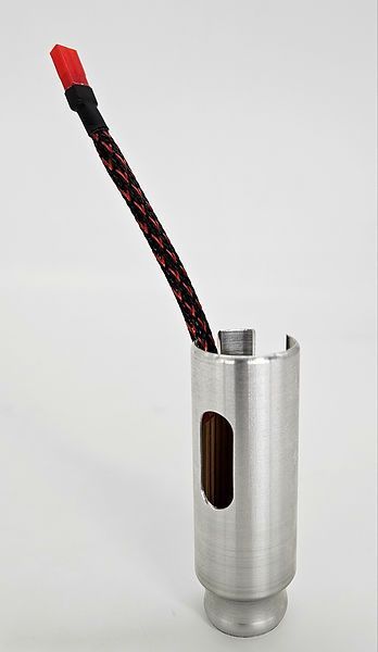 Silver cylindrical holder with a red-and-black braided cable protruding from the top.
