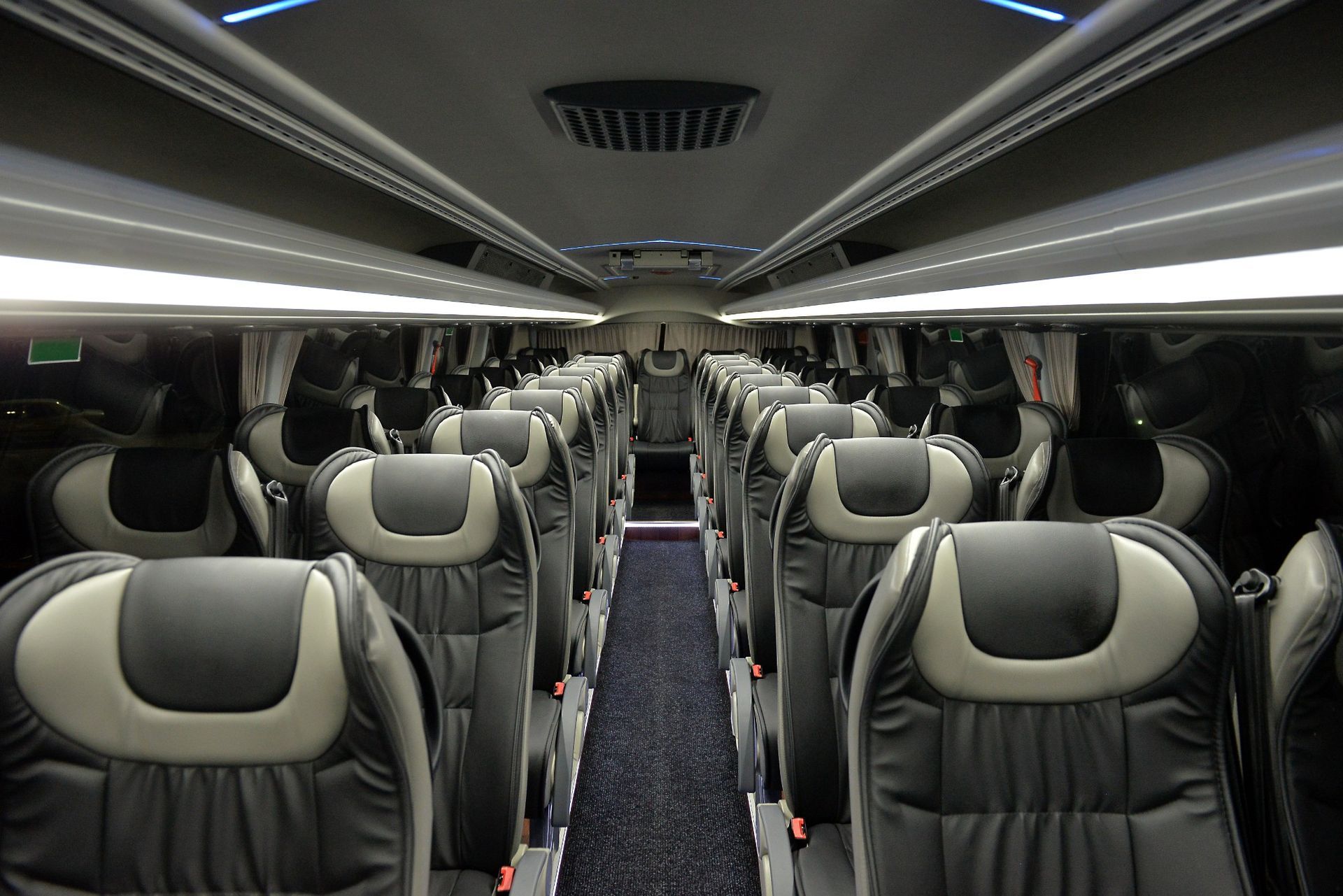 The inside of a bus with a lot of seats