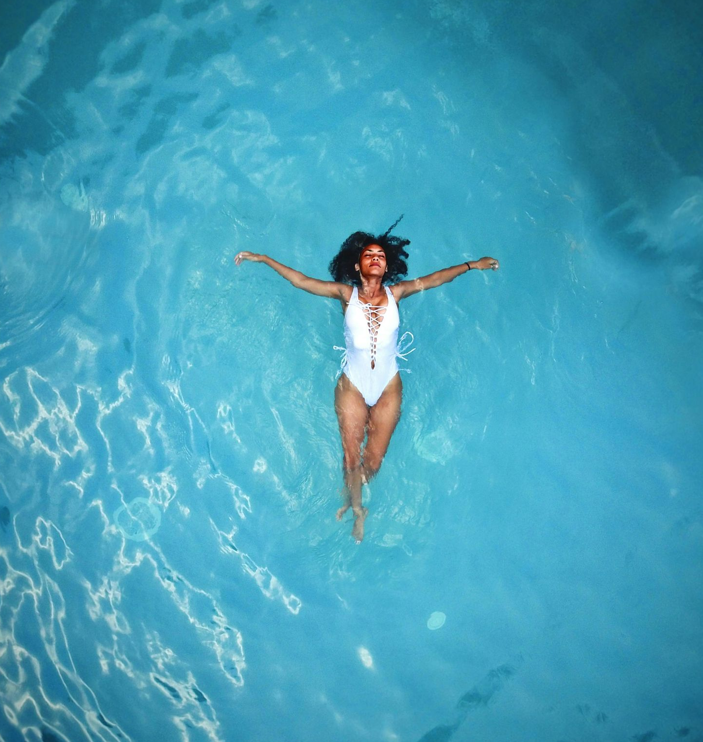 Grilled meats, sausages, and vegetable skewers on a barbecue grill.