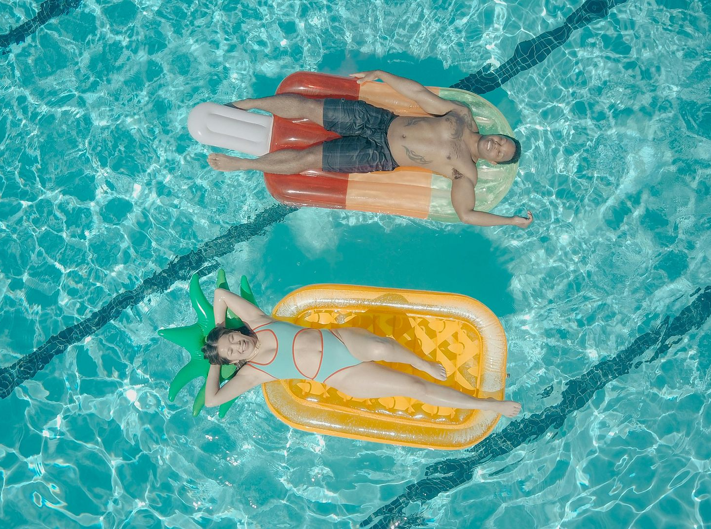 Grilled meats, sausages, and vegetable skewers on a barbecue grill.