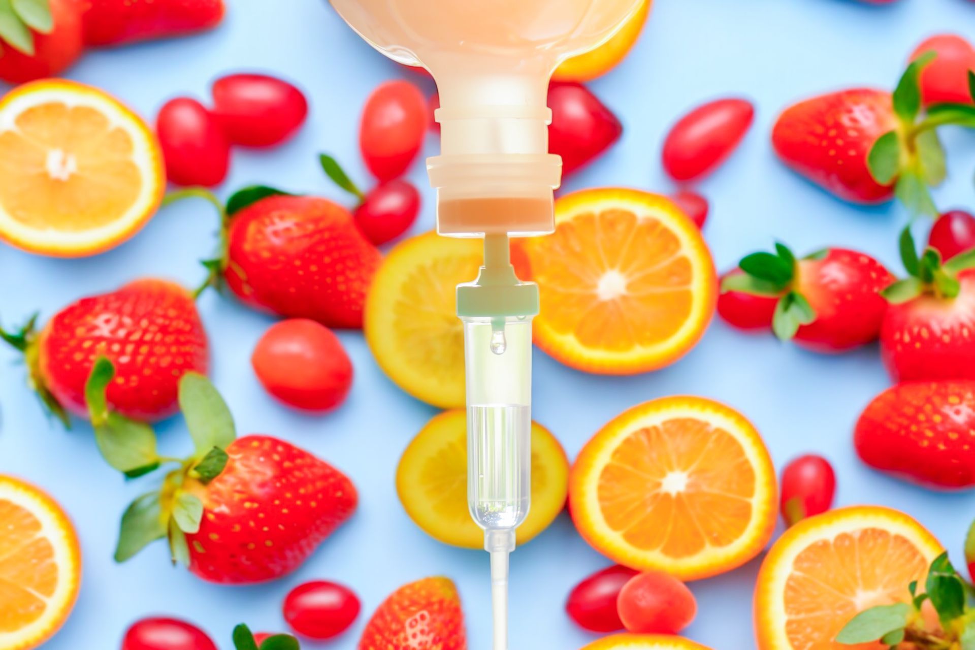 A bottle of liquid is being poured into a syringe surrounded by fruit.