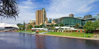 A large body of water surrounded by buildings in a city.