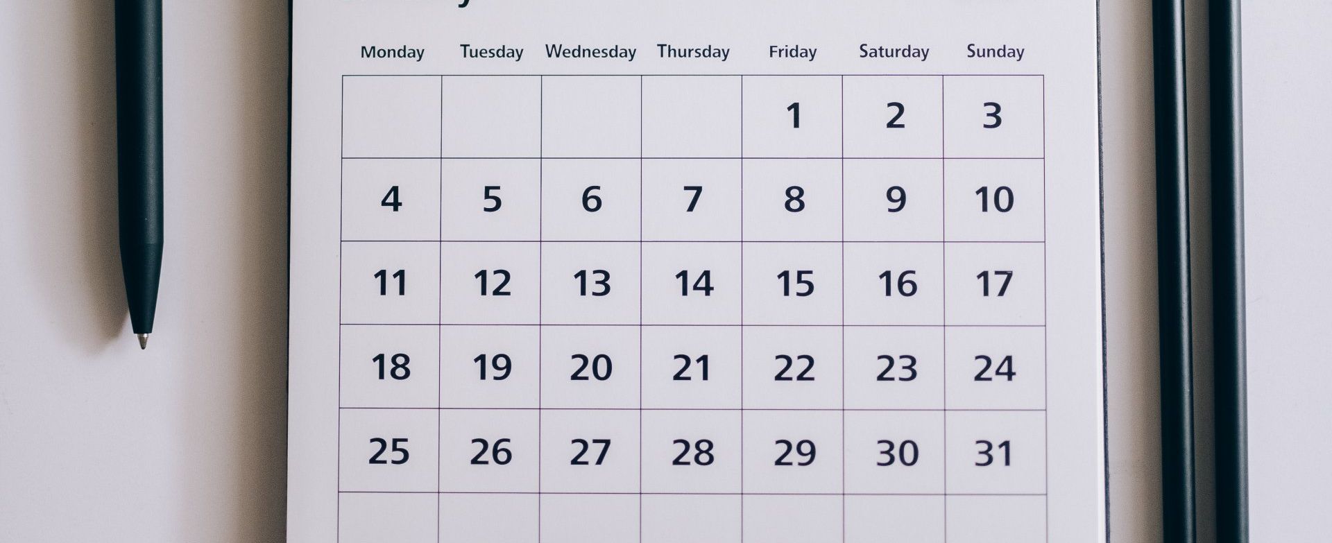 picture of a paper calendar showing one month worth of dates.