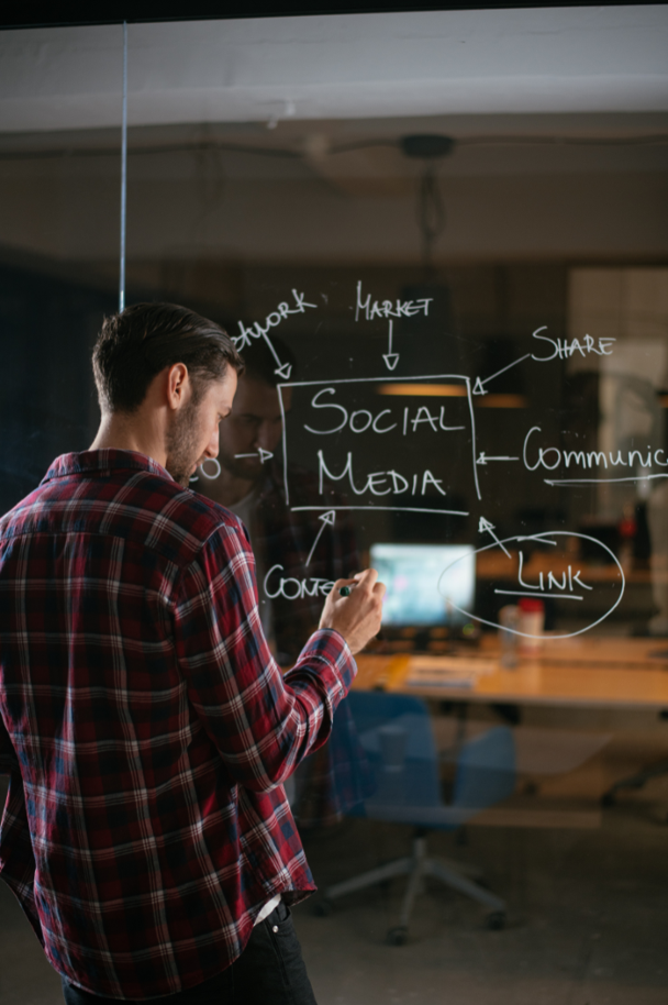 social media expert writing on a glass wall