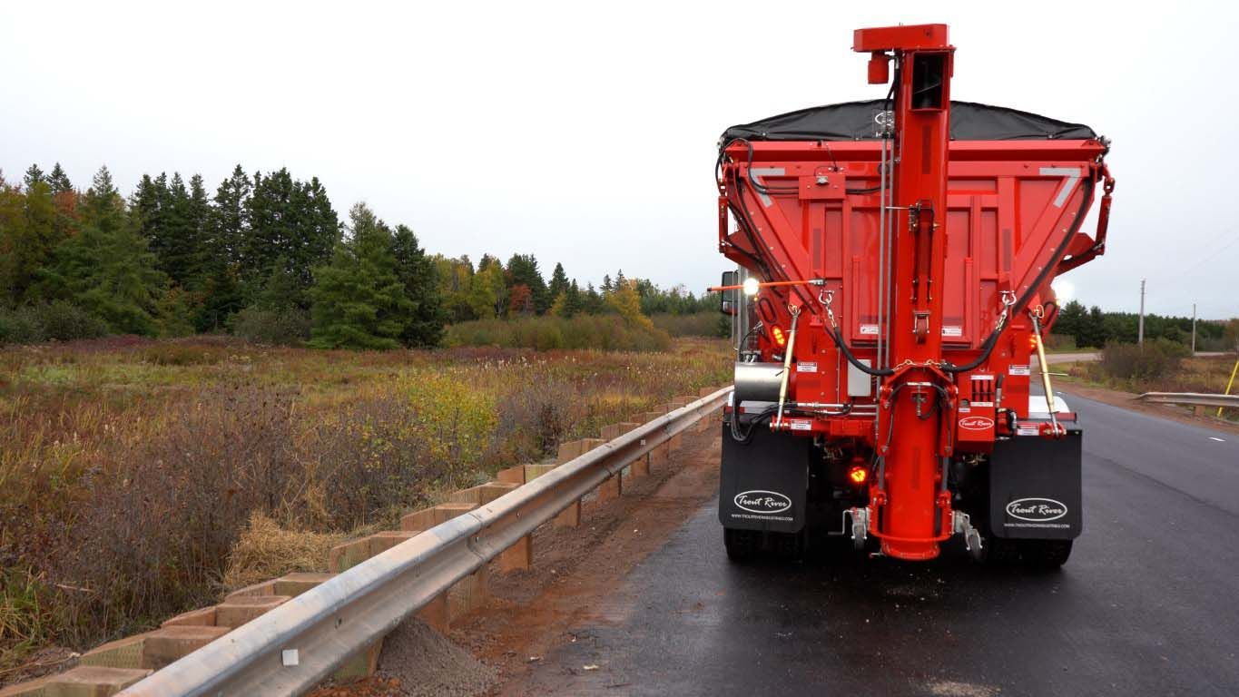 Trout River Industries truck-mounted live bottom auger in the upright position 