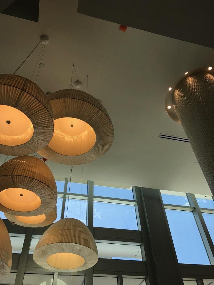 A ceiling with a lot of lights hanging from it