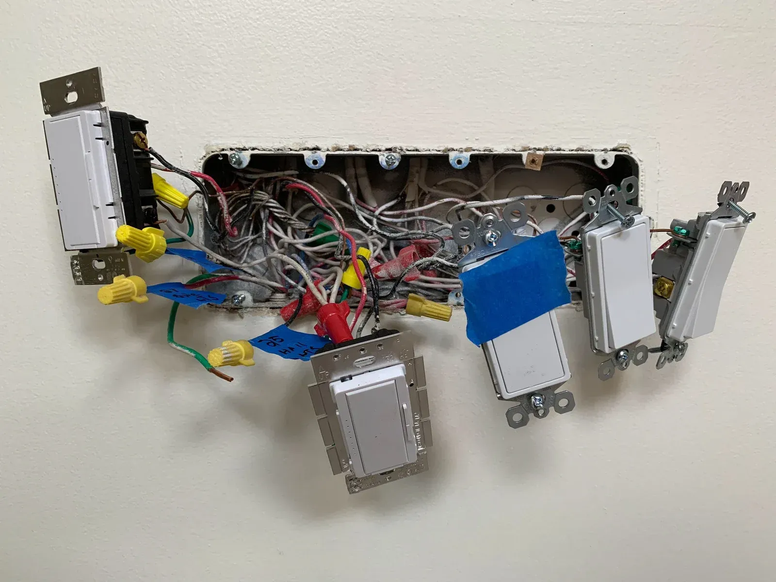 A bunch of wires are laying on a white surface.