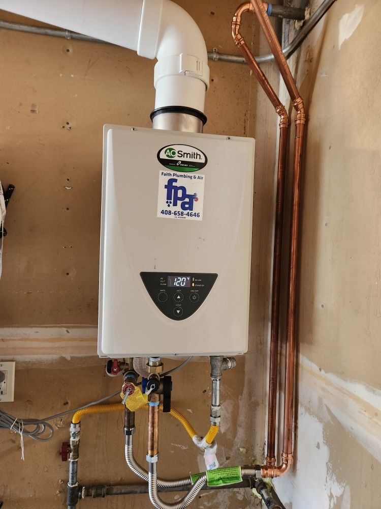 Tankless water heater with copper pipes, connected to gas lines and a white exhaust vent.
