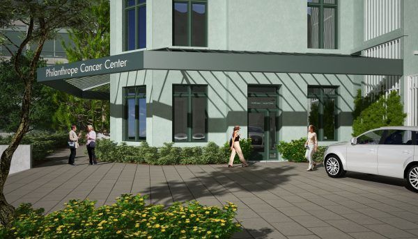 A multi-story green building titled 