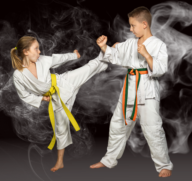 A boy and a girl are practicing karate in a dark room.