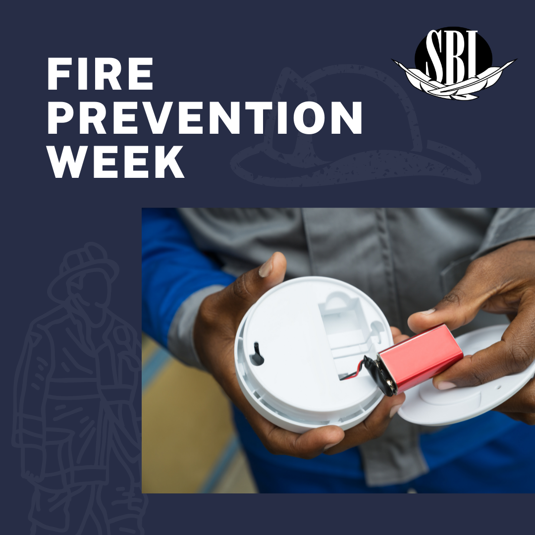 A fire prevention week poster with a person holding a smoke detector