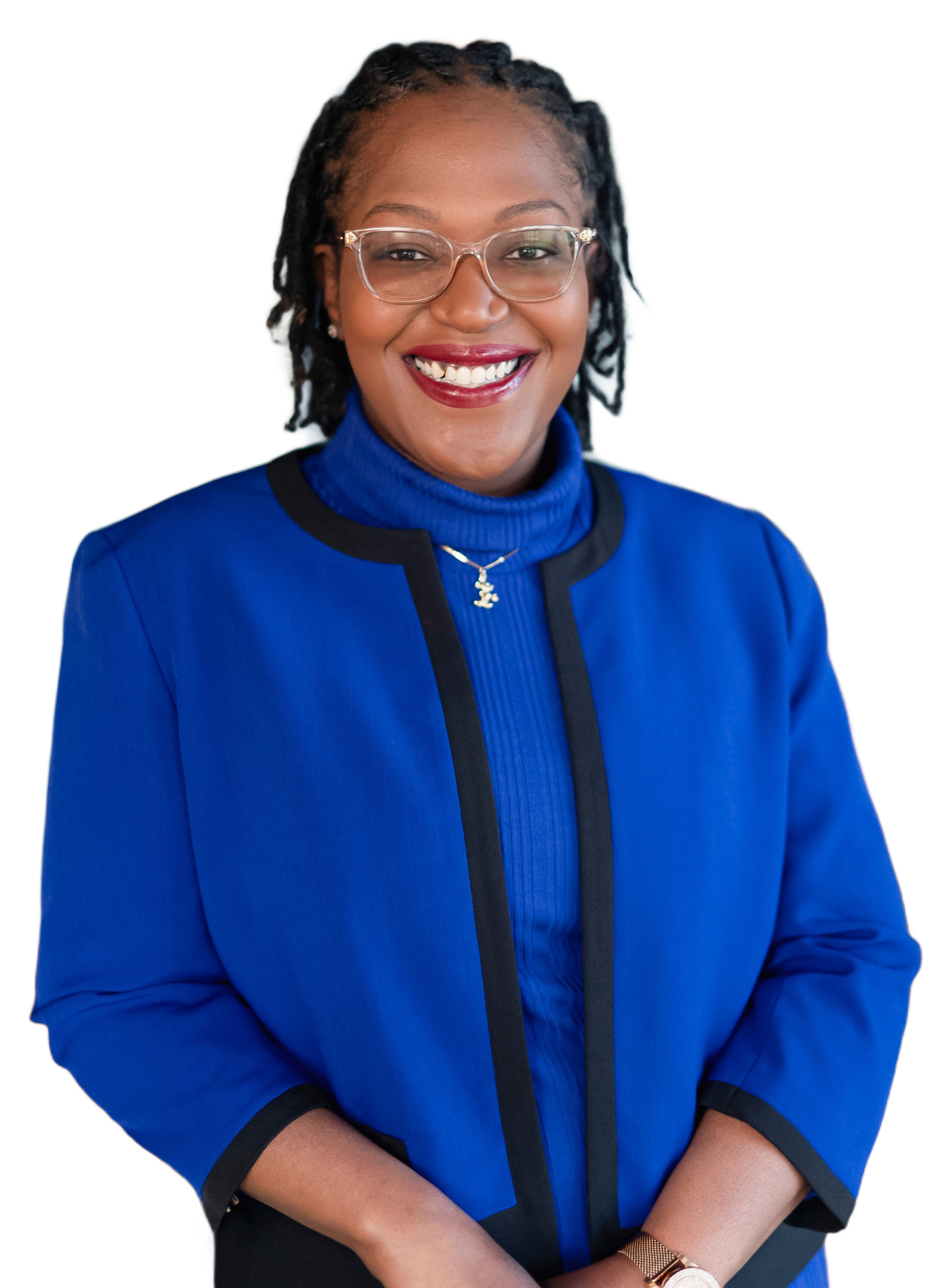 Woman in a blue jacket and turtleneck smiling, wearing glasses and a watch.