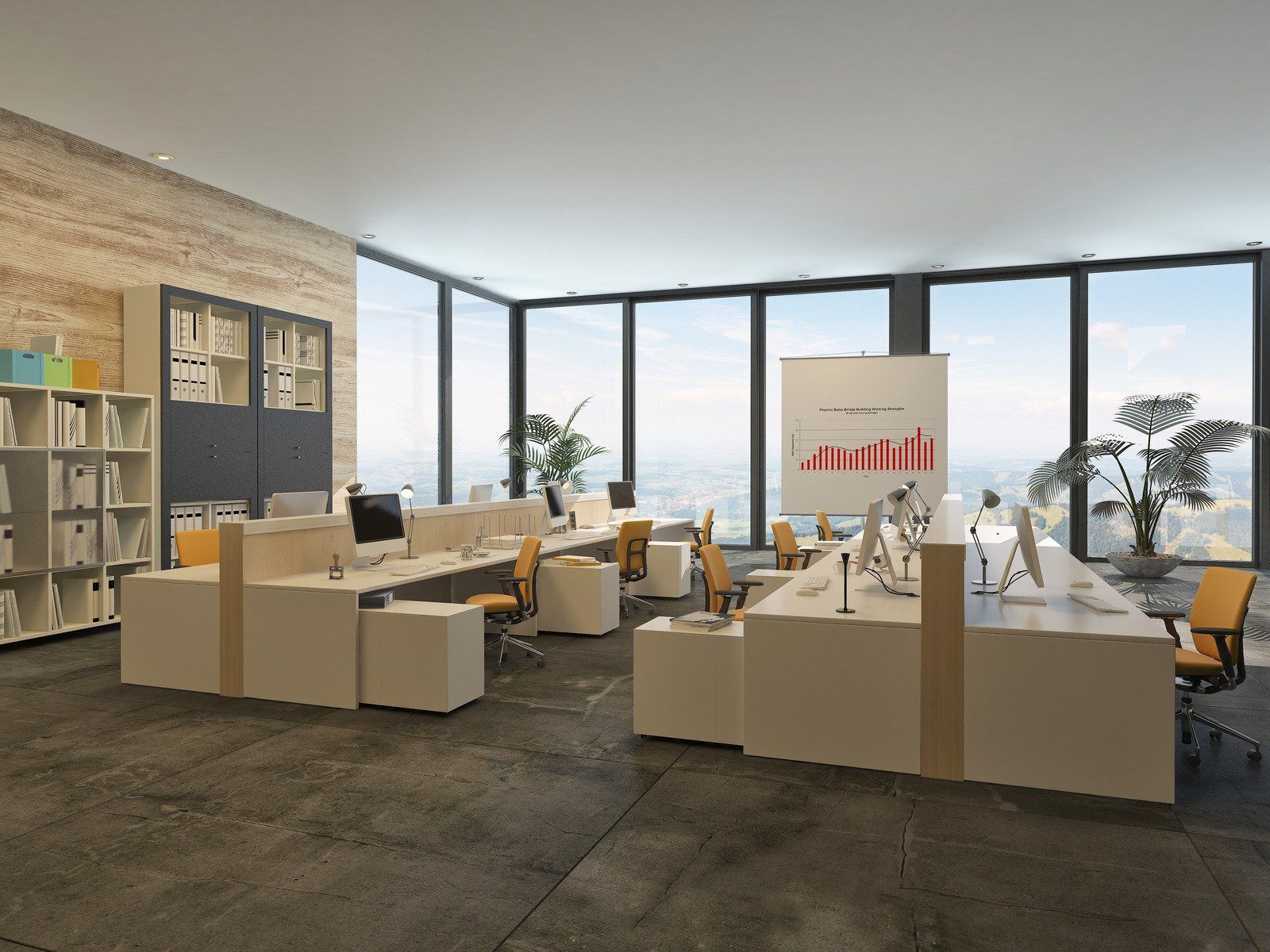 Modern office with desks, computers, and large windows overlooking a cityscape.