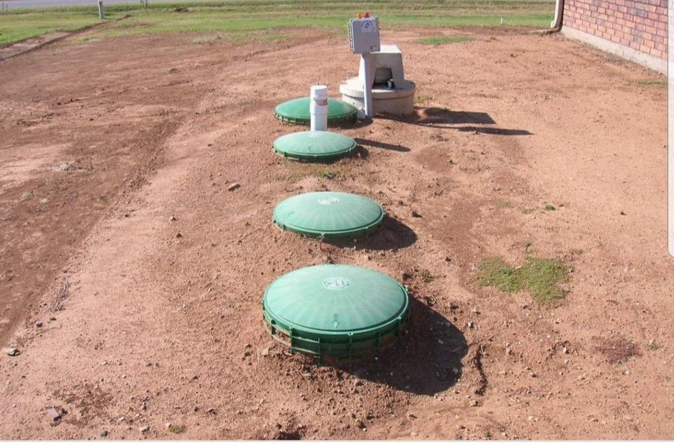 Septic Installations — Excavator Installing a Septic Tank in Elmendorf, TX